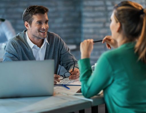 Image: Business owner reviewing insurance policies
