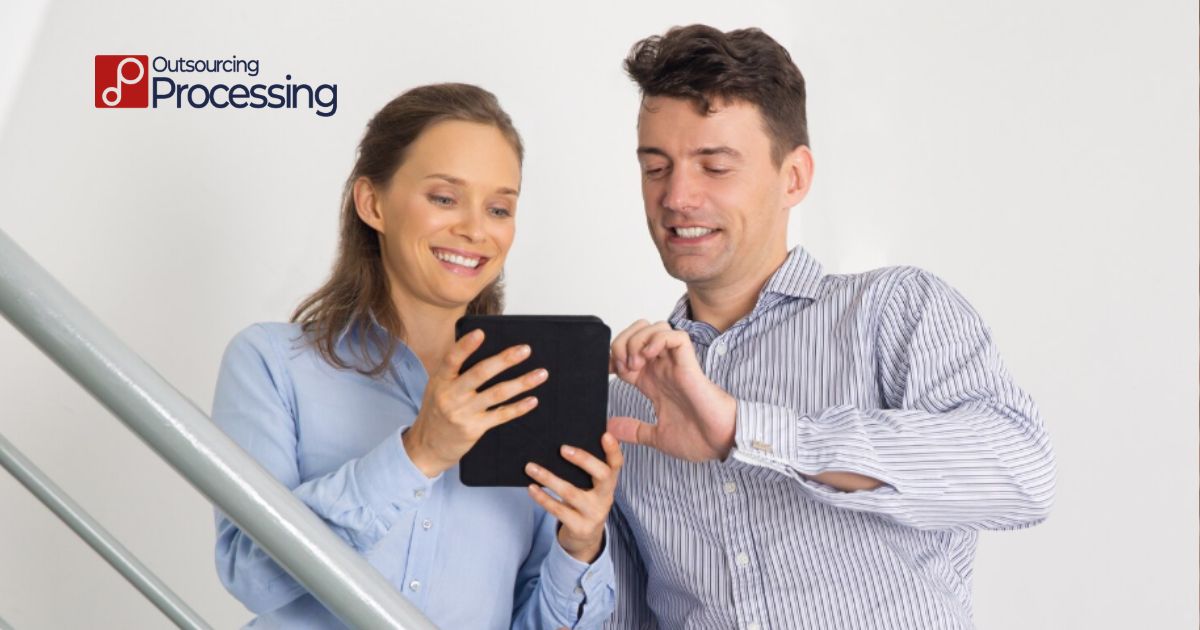 Small business owner organizing unorganized bank statements and transaction data to catch up on 6 months of bookkeeping